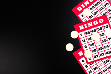 Bingo cards on black background.