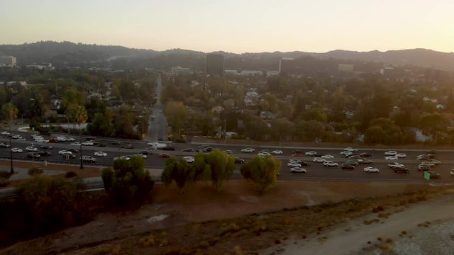 Aerial of busy traffic filled highways of the 101 and 405 in the San Fernando Valley of Los Angeles.