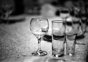 Wine glasses on the table in the restaurant with a beautiful blurred background and bokeh.Celebration.