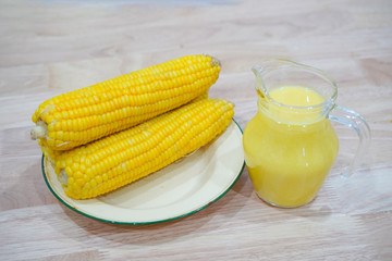 Corn and corn on a wooden table