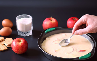 Preparation of apple pie at home. Homemade pastries with apples and nuts. Sweet dessert from apples...