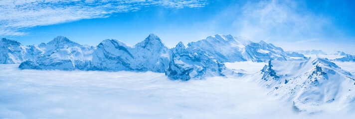 Stunning Panoramic view snow mountain of the Swiss Skyline from Schilthorn Piz Gloria, Switzerland