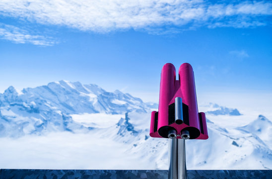 Coin operated binocular viewer to see the amazing voew of the Swiss Skyline at Schilthorn Piz Gloria in Switzerland