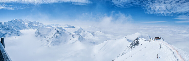 Stunning Panoramic view snow mountain of the Swiss Skyline from Schilthorn Piz Gloria, Switzerland