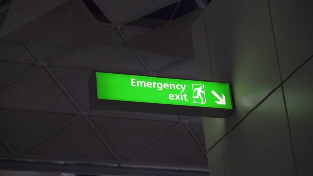 Emergency exit sign in an airport.