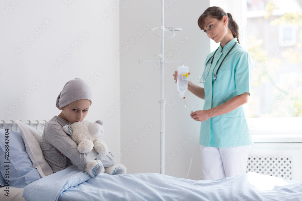 Canvas Prints Doctor with drip visiting sad sick girl with cancer hugging plush toy in the hospital