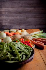 Ingredients to prepare vegan or vegetarian food, healthy food for vegan or vegetarian people, potatoes, carrots, onions, chili, beans, chives, zucchini, raw vegetables to prepare food