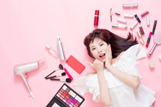 woman smile with makeup tools
