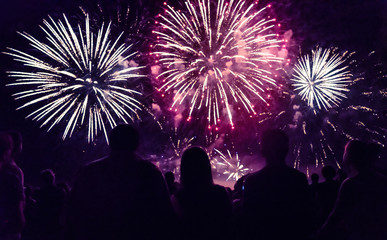 Fototapeta na wymiar Crowd watching fireworks and celebrating new year