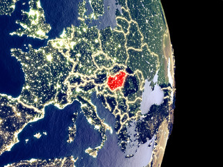 Satellite view of Hungary at night with visible bright city lights. Extremely fine detail of the plastic planet surface.