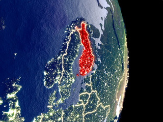 Satellite view of Finland at night with visible bright city lights. Extremely fine detail of the plastic planet surface.