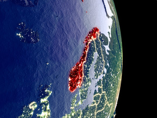 Satellite view of Norway at night with visible bright city lights. Extremely fine detail of the plastic planet surface.