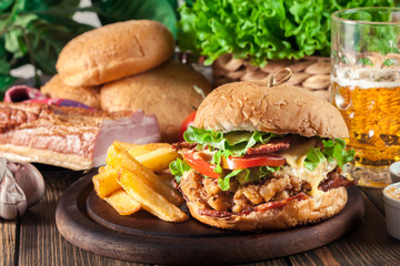 Chickenburger with bacon, tomato, cheese and lettuce