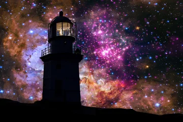 Foto op Canvas Lighthouse at night on the background of a beautiful starry sky. © Anton Petrus