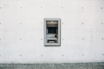 Modern street ATM machine for withdrawal of money and other financial transactions.