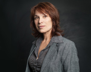 Smiling mature businesswoman in suit