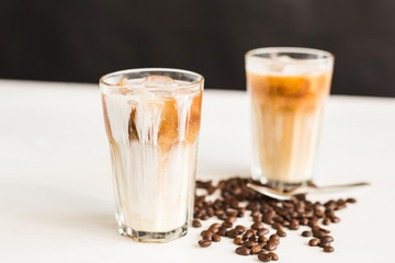 Delicious drink concept - Iced coffee in a glass with ice.