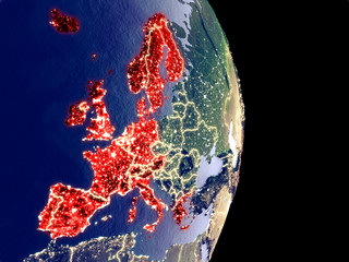 Satellite view of Western Europe at night with visible bright city lights. Extremely fine detail of the plastic planet surface.