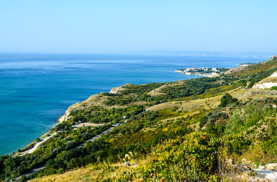 Green Thracian cliffs near blue clear water of Black Sea, rocky path seaview