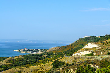 Green Thracian cliffs near blue clear water of Black Sea, rocky path seaview