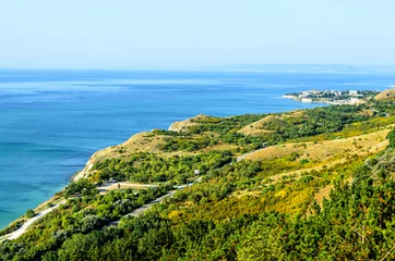 Fotobehang Green Thracian cliffs near blue clear water of Black Sea, rocky path seaview © Negoi Cristian
