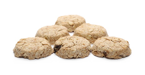 Integral round oatmeal cookies with raisins isolated on white background