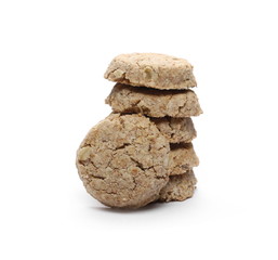 Integral round oatmeal cookies with raisins isolated on white background