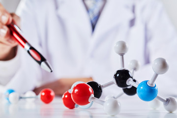 Close up of scientist with molecular models
