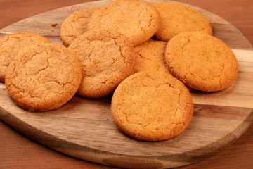 A closeup photo of ginger cookies on rustic textures