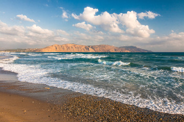 Sandy beach of resorts on northwest of Crete island between Chania and Rethymno cities, Greece, Europe.