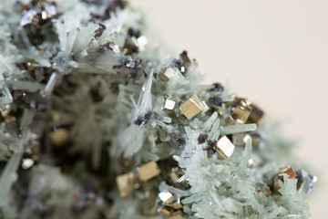 Pyrite on white background, also known as iron pyrite and fools gold