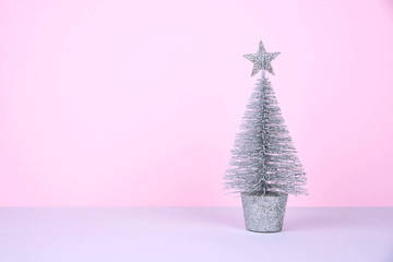 Christmas tree over pink background.