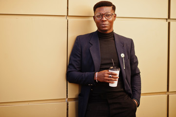 Amazingly looking african american man wear at blue blazer with brooch, black turtleneck and...