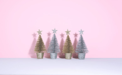 Christmas tree over pink background.