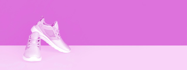 Shot of sneakers on lilac background.
