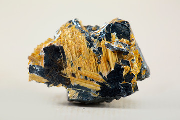 Rutile Needles in Quartz Caption: Rutile needles suspended in polished transparent quartz chip. Locality: Brazil