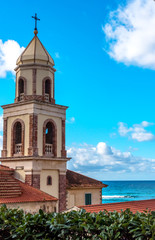 Fototapeta na wymiar Old Church Steeple in a Village along the southern Italian Mediterranean Coast