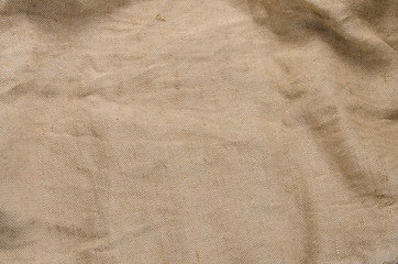 Fototapeta na wymiar crumpled piece of real sackcloth. burlap with voluminous shadows and good texture