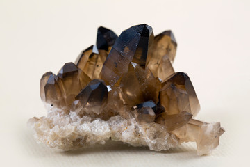 Macro mineral stone Morion crystal in the rock a white background close up