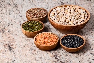 Various assortment of legumes - beans, chickpeas, lentils, black  and green orid dal. Vegetable proteins.