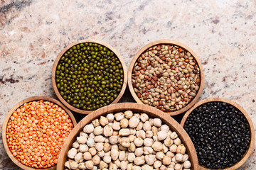 Various assortment of legumes - beans, chickpeas, lentils, black  and green orid dal. Vegetable proteins.