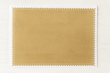 Empty brown paper on white table background.