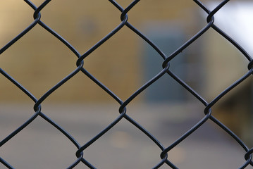 Fototapeta premium Black painted wire mesh fence