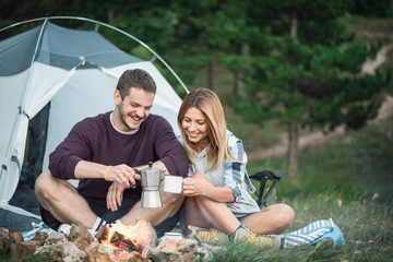 Young couple camping on mountain 