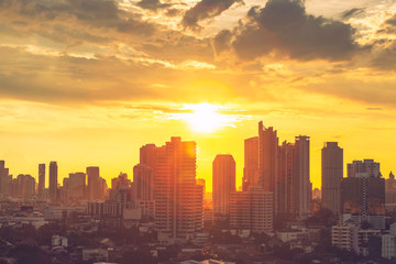 Fototapeta premium High modern building in business city center of Bangkok at sunset. Travel to Thailand.