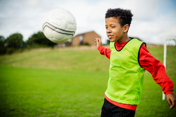 Junior football player playing on the field