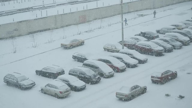 GOMEL, BELARUS - NOVEMBER 25, 2018: Snowfall on a parking in the city.