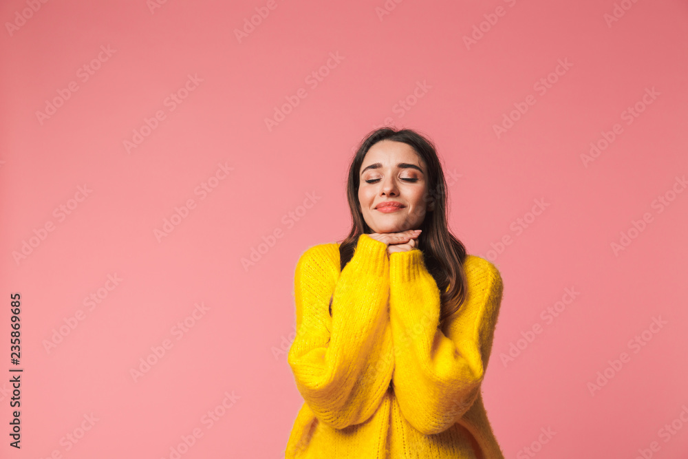 Sticker Beautiful happy young emotional woman posing isolated over pink background.