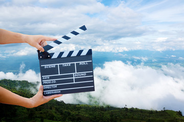 Man hands holding movie clapper.Film director concept.camera show viewfinder image catch motion in...
