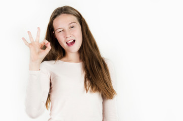 Bright beautiful girl emotionally posing on an isolated background.